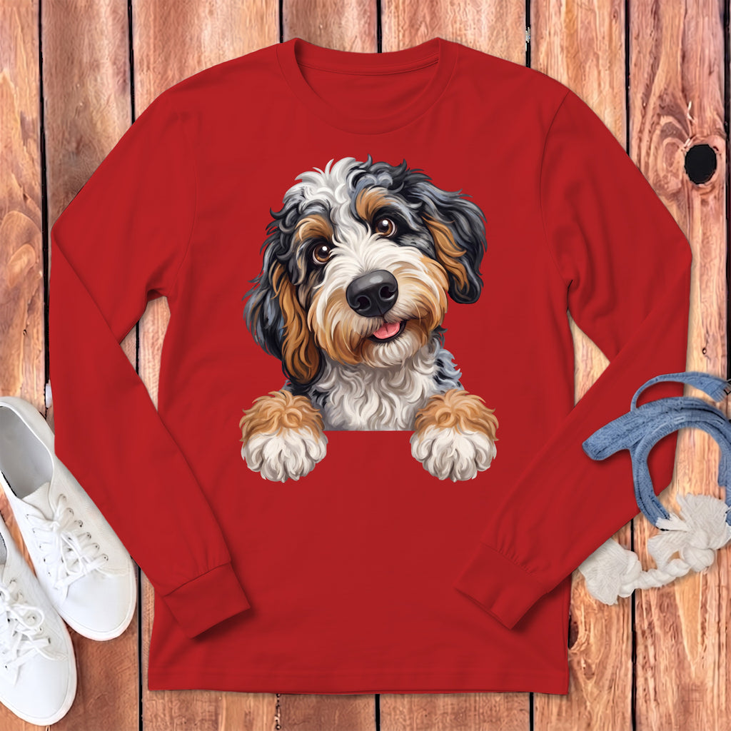 Red long-sleeve shirt with a Bernedoodle puppy graphic and white sneakers.