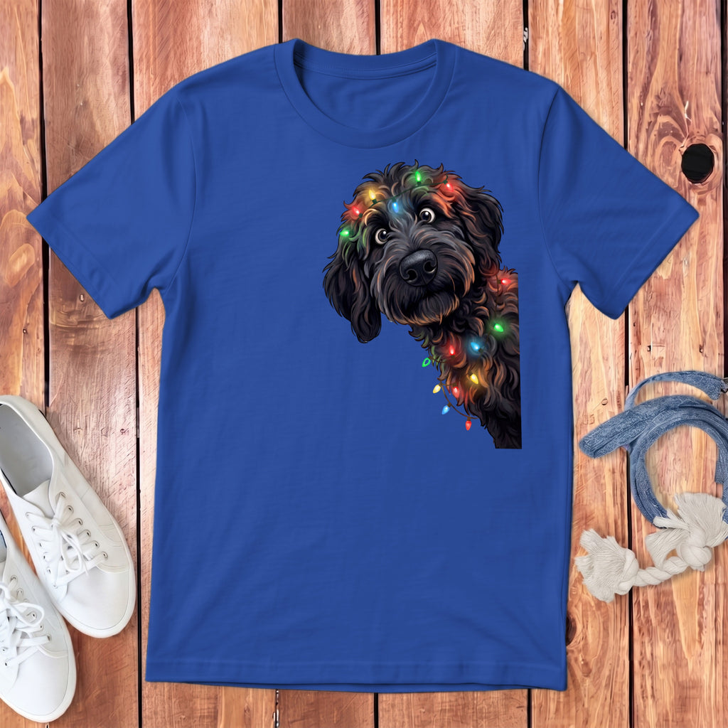 Blue t-shirt with a black dog wearing colorful Christmas lights.