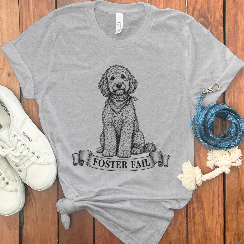 Grey t-shirt with doodle dog graphic and "FOSTER FAIL" text on a banner.