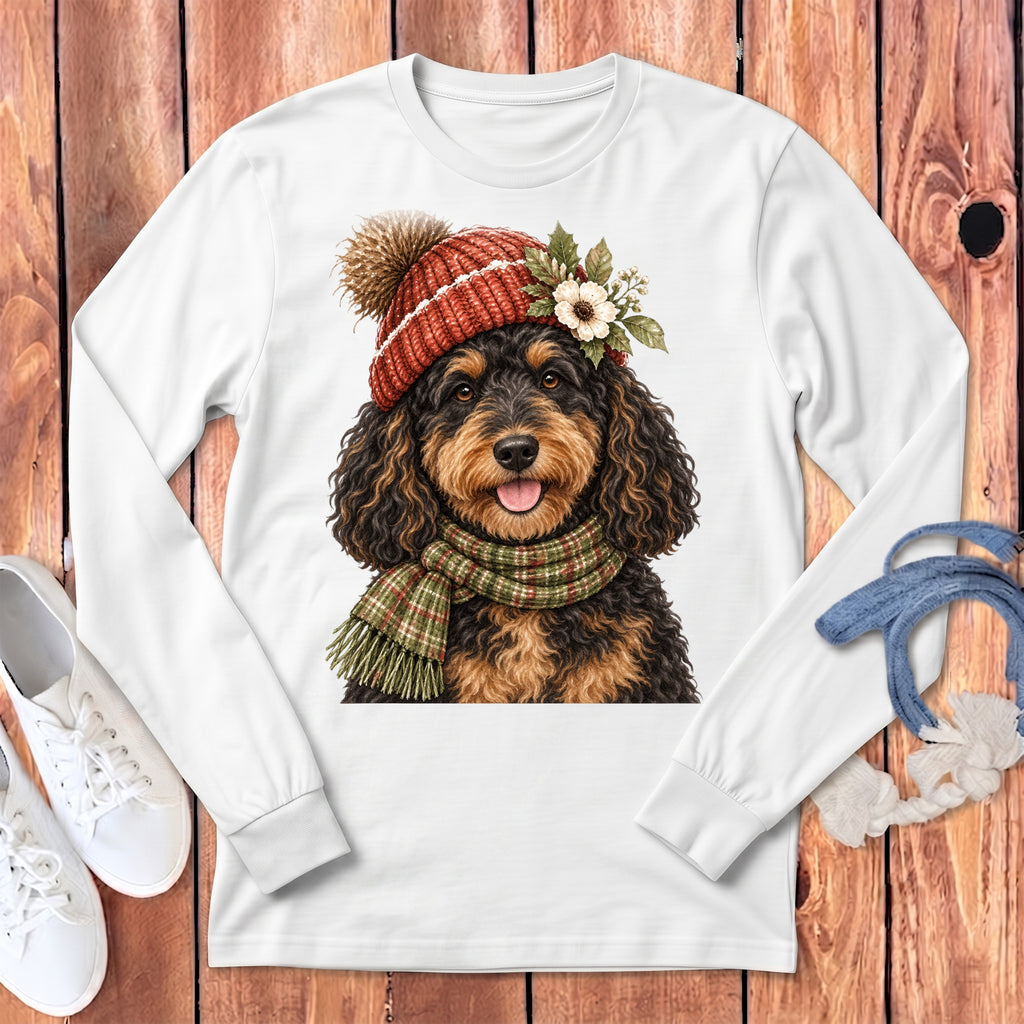 White long-sleeve shirt with a watercolor doodle dog wearing a beanie and scarf.