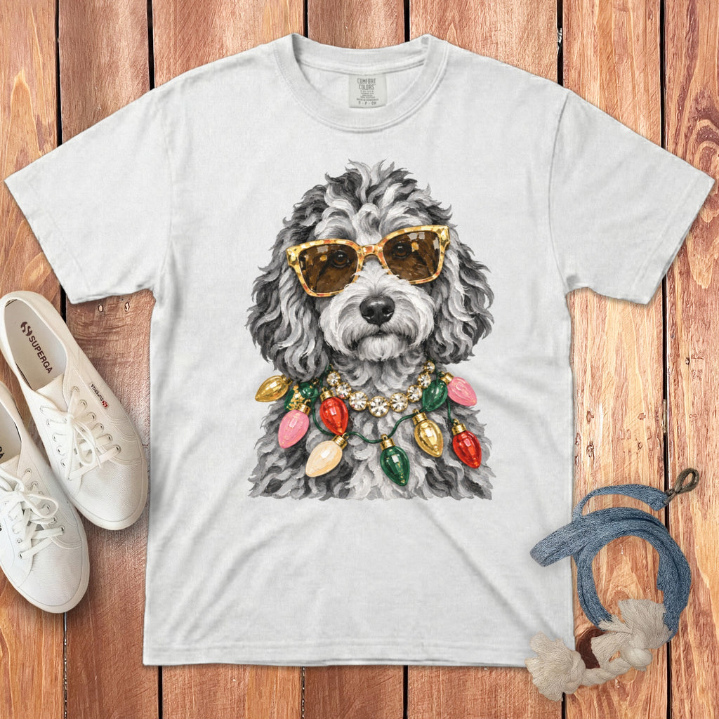 White t-shirt with a dog wearing sunglasses and Christmas lights.