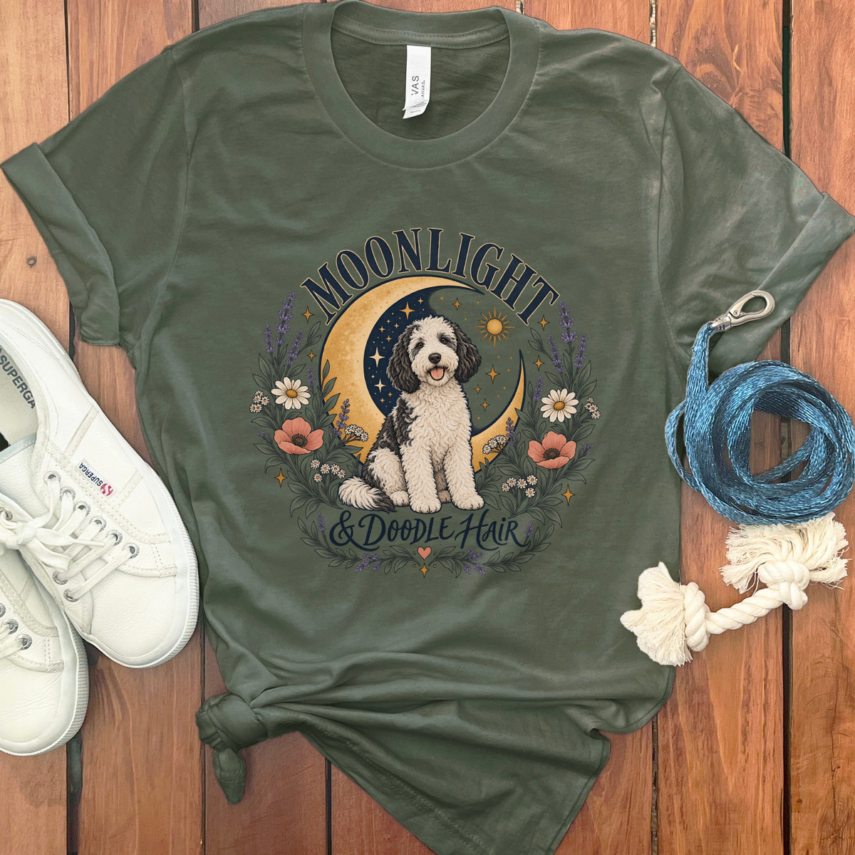 Green t-shirt with "Moonlight & Doodle Hair" design featuring a dog on a crescent moon.