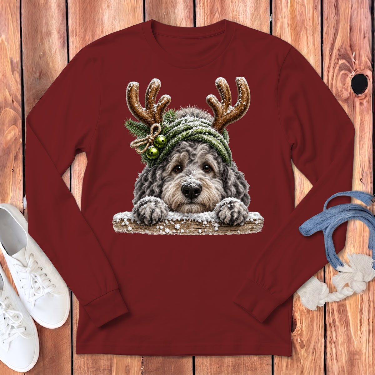 Maroon long-sleeve shirt with a Christmas doodle dog wearing antlers and a beanie.