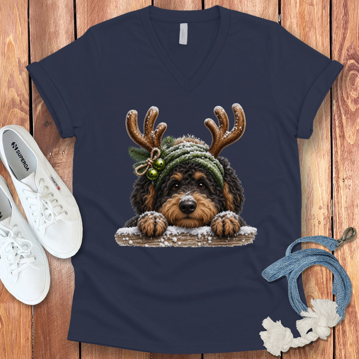 Cute dog with reindeer antlers and a winter hat on a t-shirt.