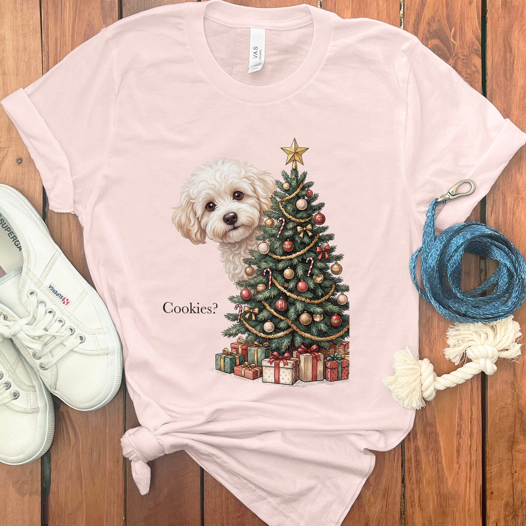 White dog peeking by Christmas tree with gifts and text "Cookies?".