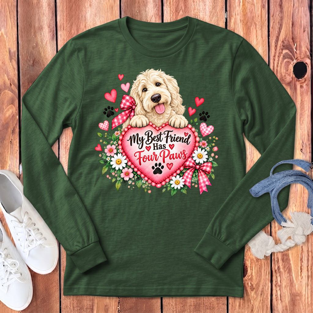 Dark green long-sleeve t-shirt with a graphic of a fluffy dog holding a heart that reads My Best Friend Has Four Paws.