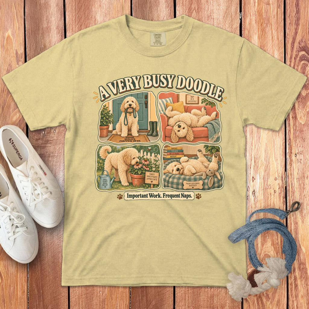 Light yellow t-shirt with "A Very Busy Doodle" graphic and dog-themed activities.