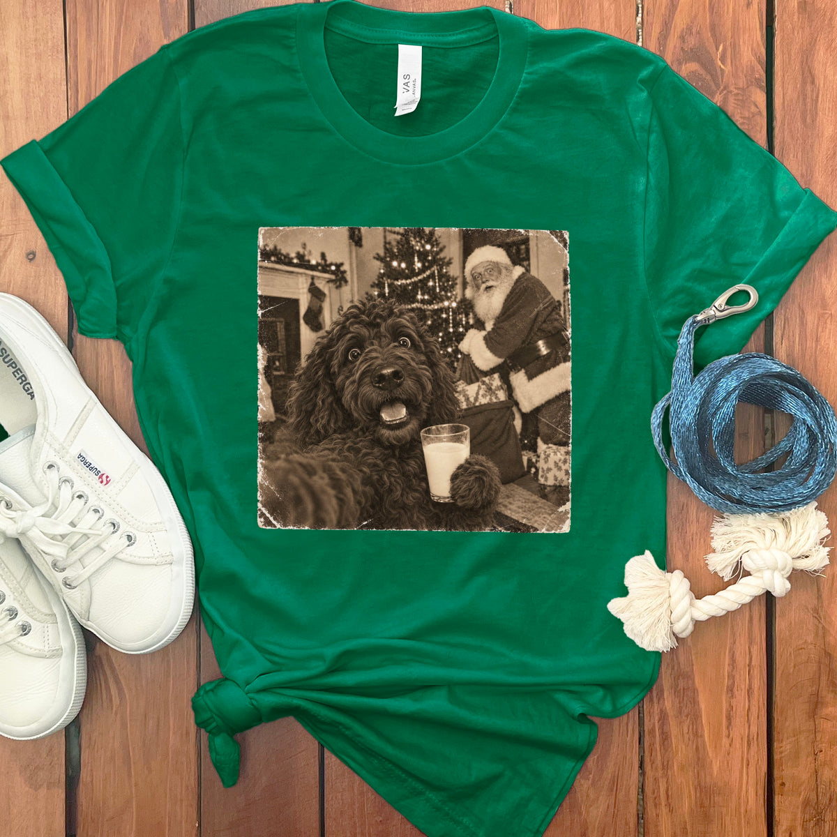 Bright green t-shirt featuring a black and white graphic of a fluffy dog holding a glass of milk with Santa Claus in the background.