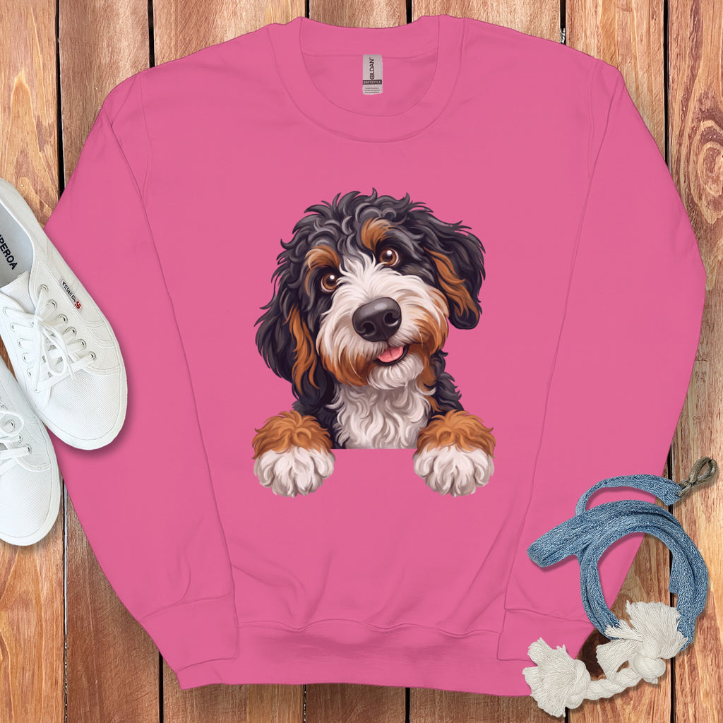 Pink crewneck sweatshirt with a watercolor Bernese Mountain Dog puppy graphic.