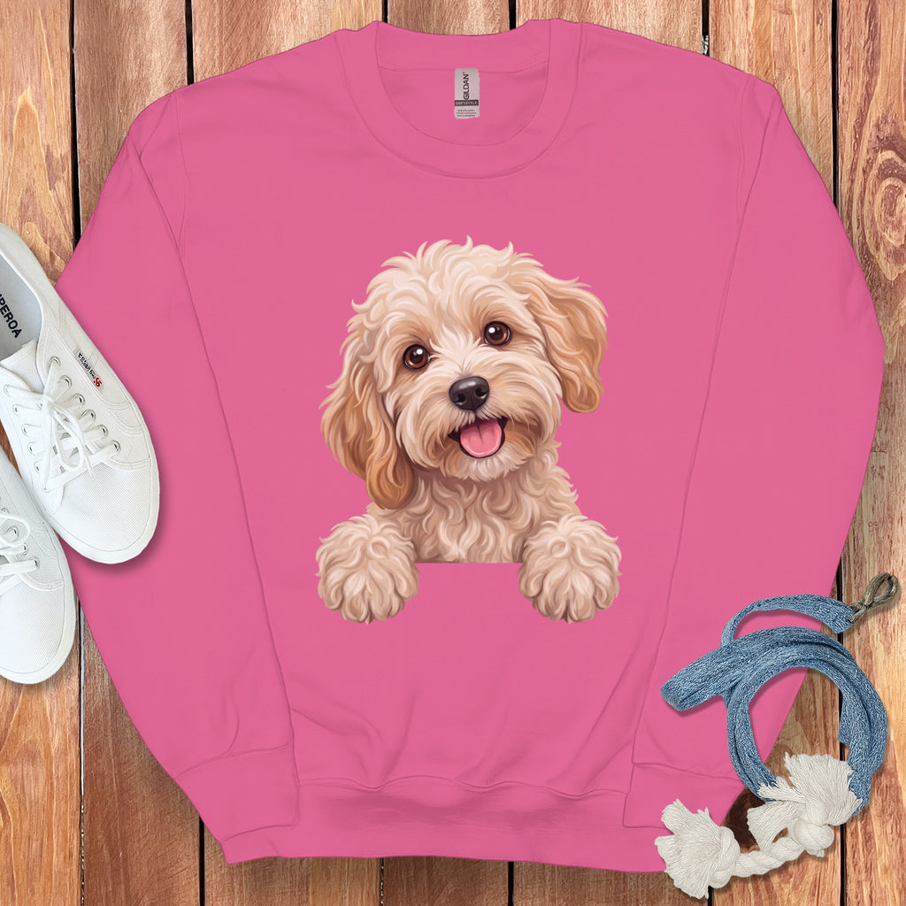 Pink sweatshirt with a watercolor-style doodle of a happy dog.