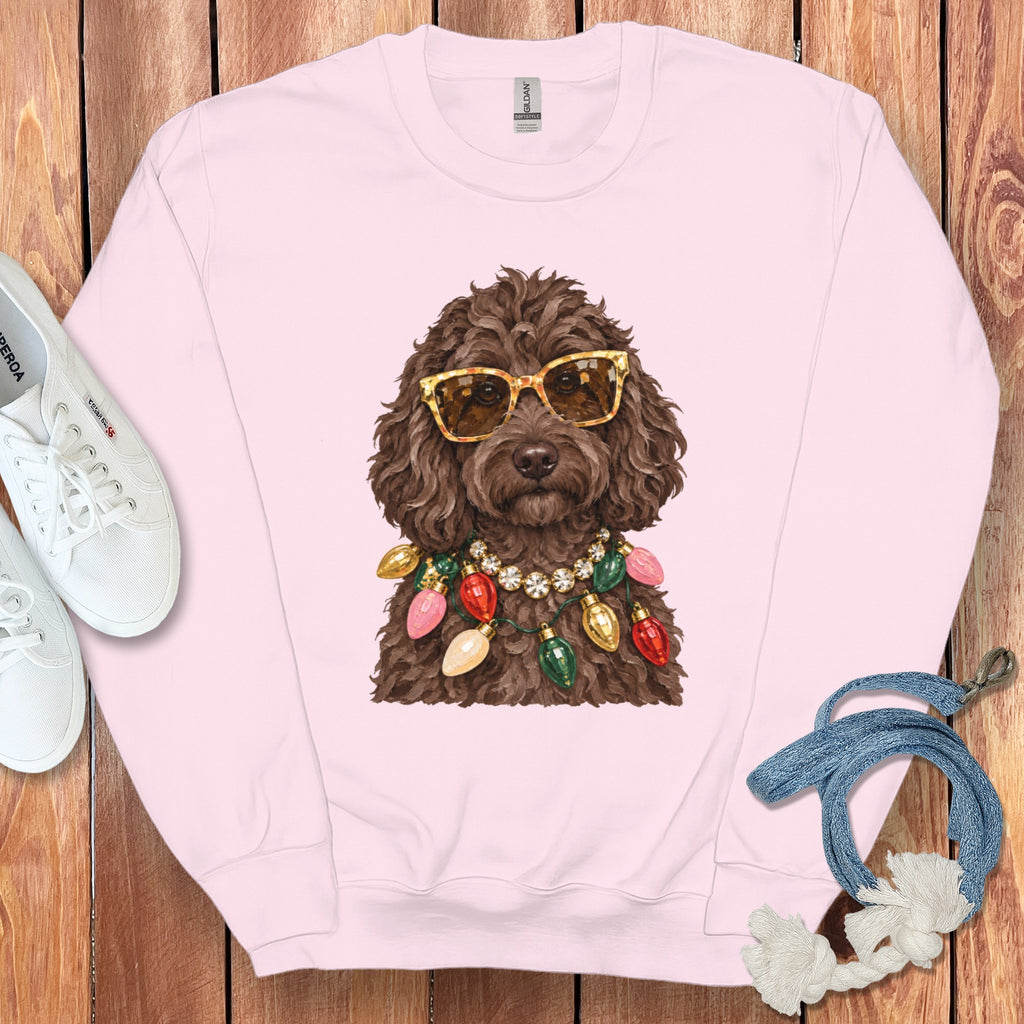 Pink sweatshirt with graphic of dog wearing sunglasses and Christmas lights necklace.