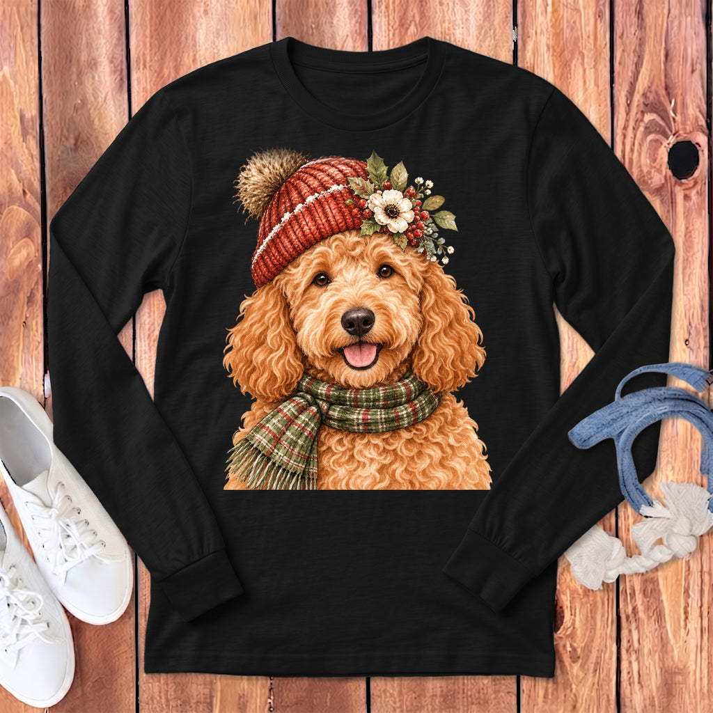 Black long-sleeve shirt featuring a watercolor doodle wearing a red knit hat and plaid scarf.