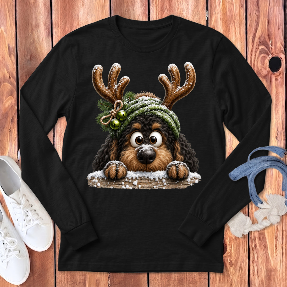 Black long-sleeve t-shirt featuring a cartoon dog wearing antlers and a beanie.