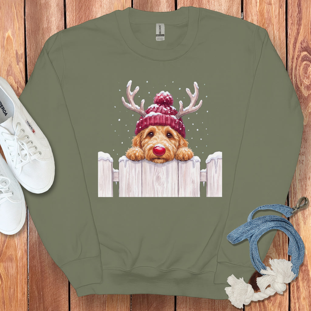 Green sweatshirt with a doodle dog wearing a beanie and reindeer antlers.