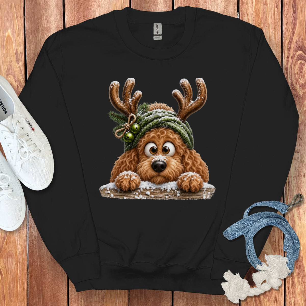 Black sweatshirt with a cartoon dog wearing antlers and a green hat.