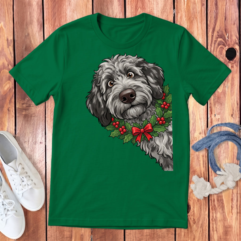 Green t-shirt with a cartoon dog wearing a holly wreath and red bow.