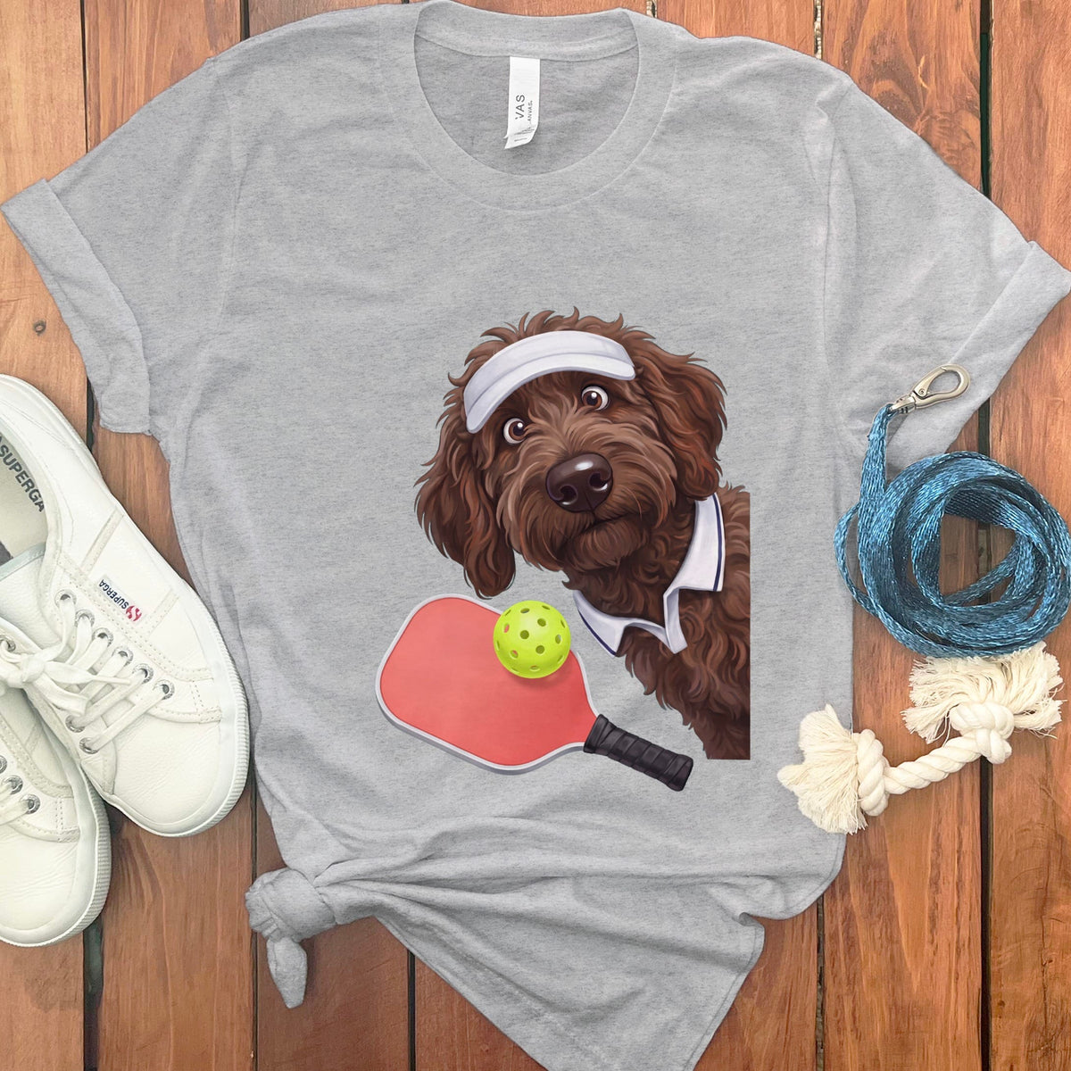 Chocolate Goldendoodle Pickleball Player T-Shirt in Athletic Heather / S by Puppy Jo