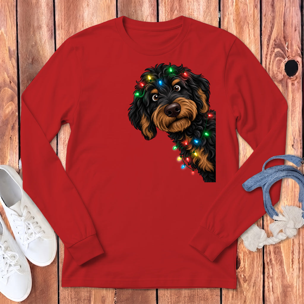 Red long-sleeve shirt with a doodle dog wearing colorful Christmas lights graphic.