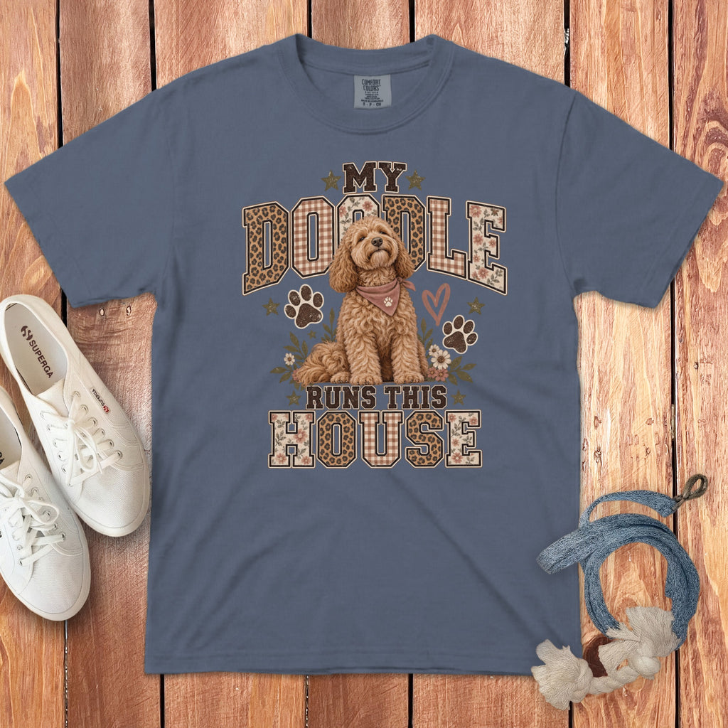 Blue t-shirt featuring a cartoon doodle dog, paws, and text reading "My Doodle Runs This House."