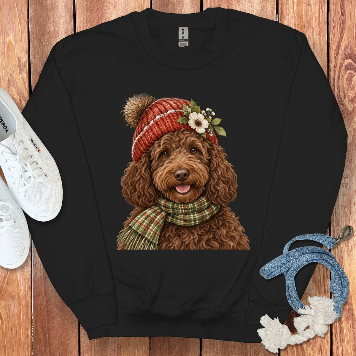 Black sweatshirt with a watercolor illustration of a doodle dog wearing a hat and scarf.