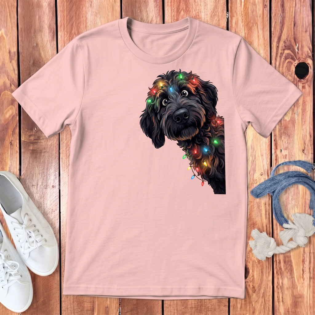 Pink t-shirt with a black dog wearing colorful Christmas lights design.