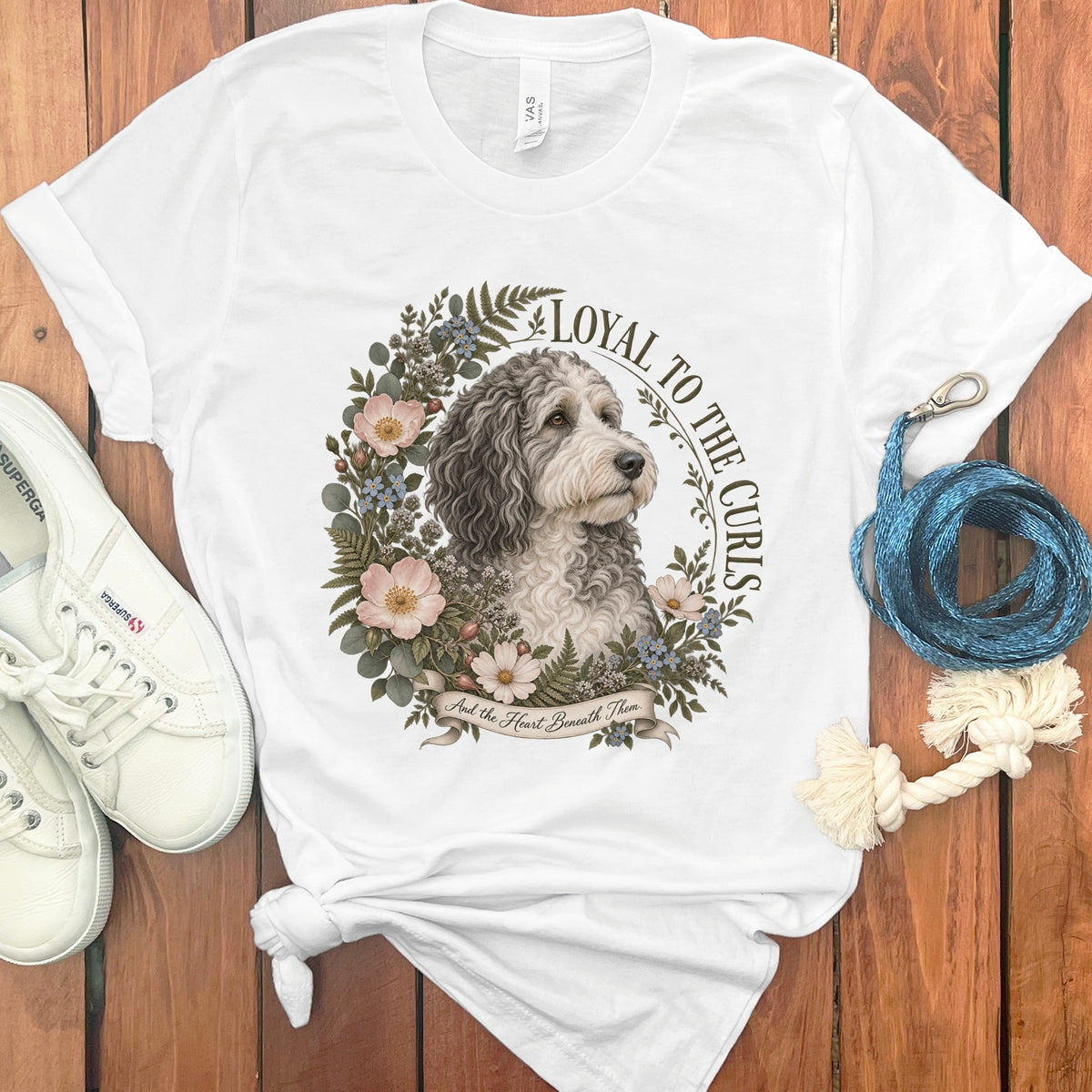 White t-shirt with a doodle dog graphic and text "Loyal to the Curls".