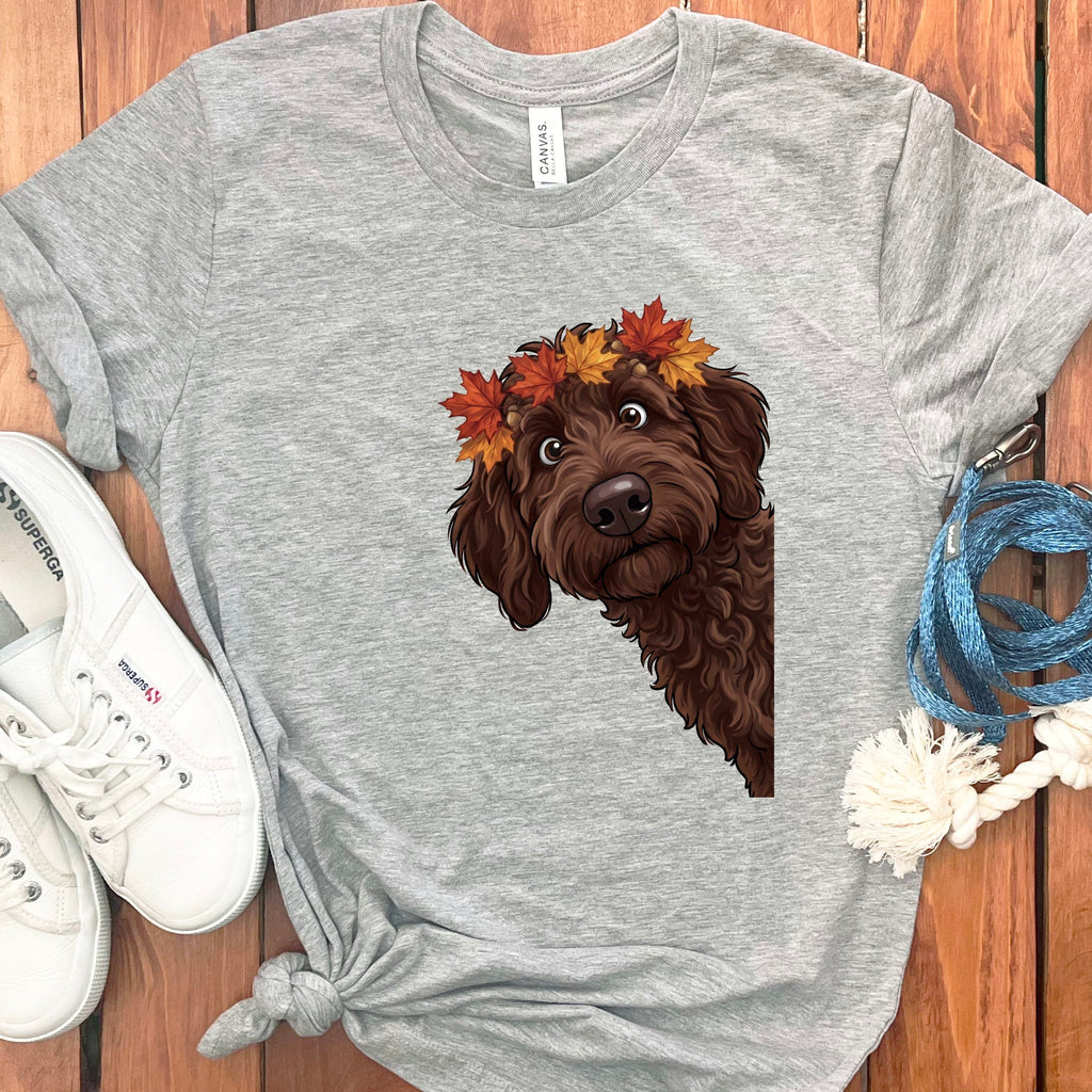 Grey t-shirt with a brown doodle dog wearing a fall leaf and acorn crown.