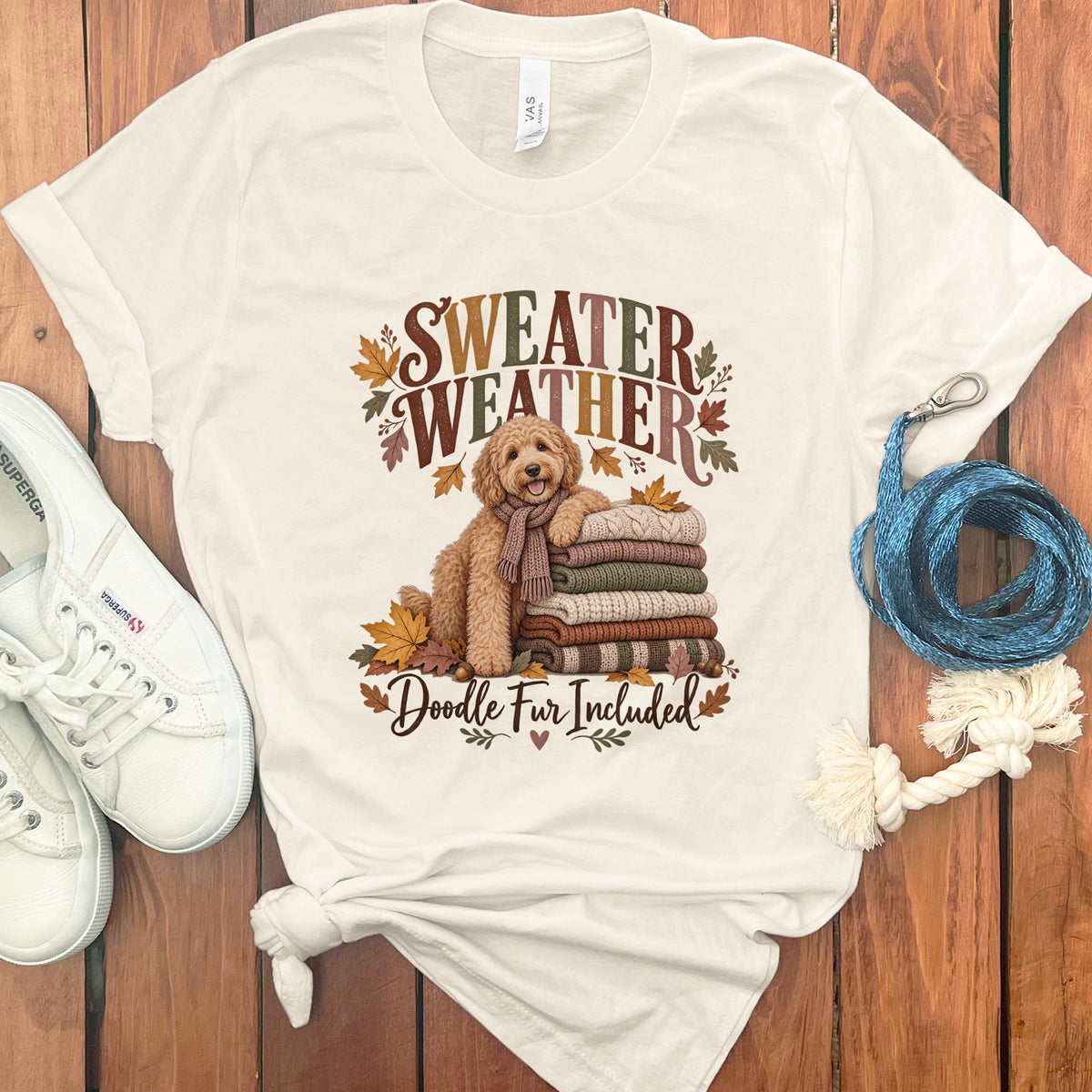 Cream t-shirt with "SWEATER WEATHER Doodle Fur Included" text and a goldendoodle.