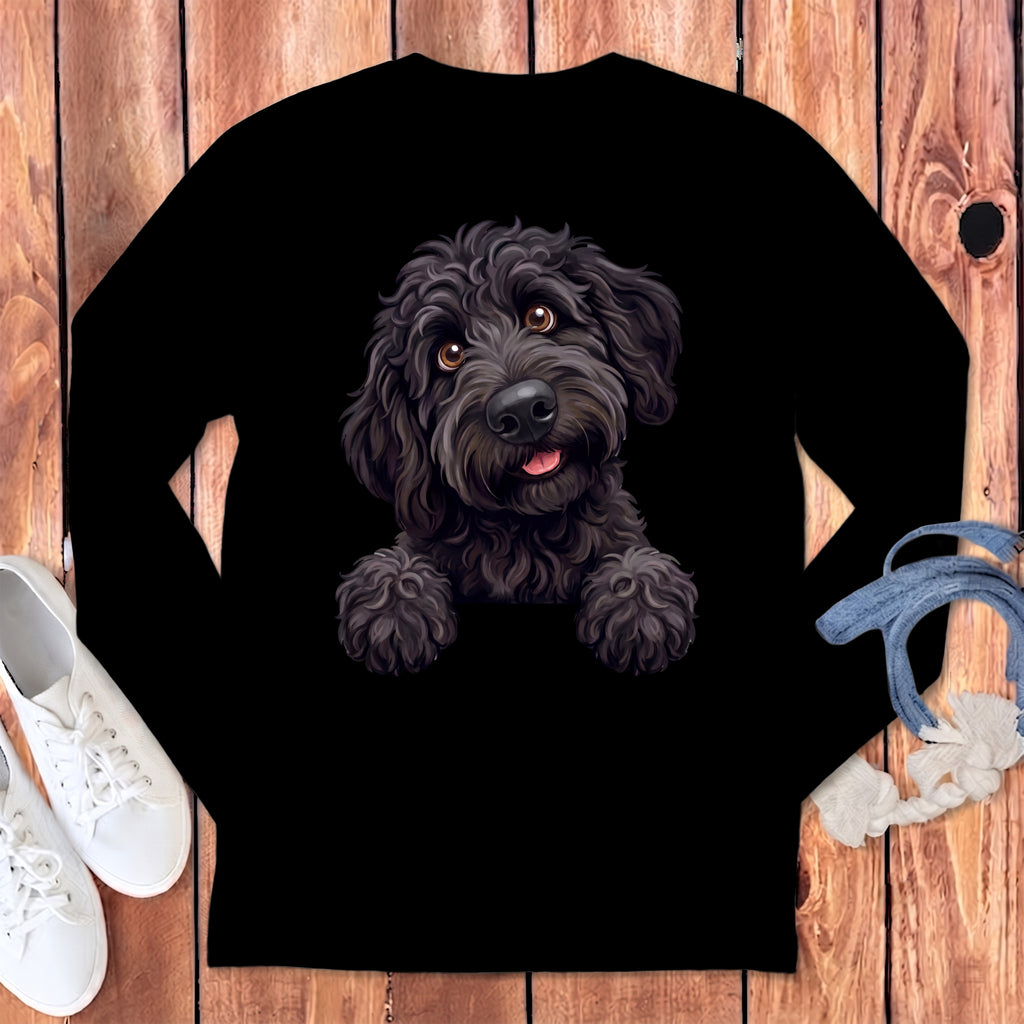 Black long-sleeve shirt with a watercolor illustration of a happy black doodle dog peeking over the collar.