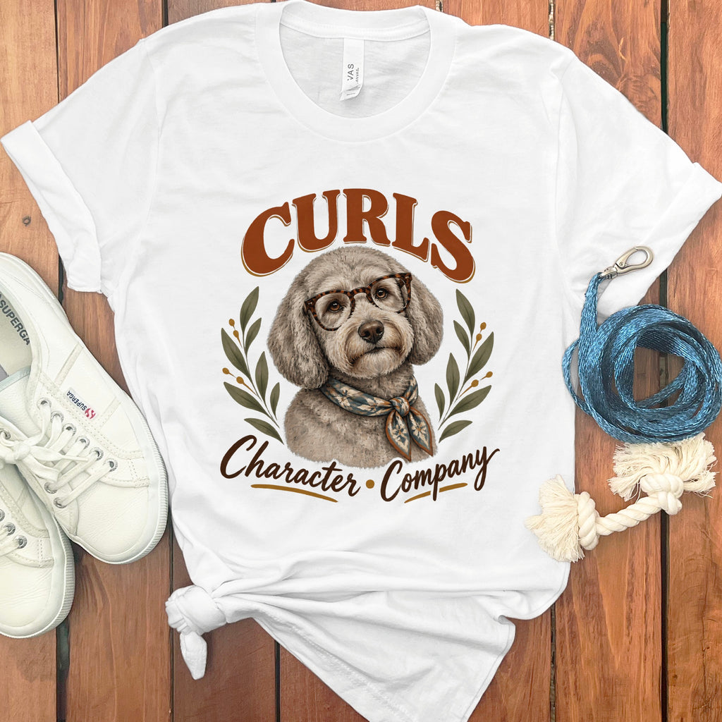 White t-shirt with a dog wearing glasses and scarf, text "CURLS Character Company".