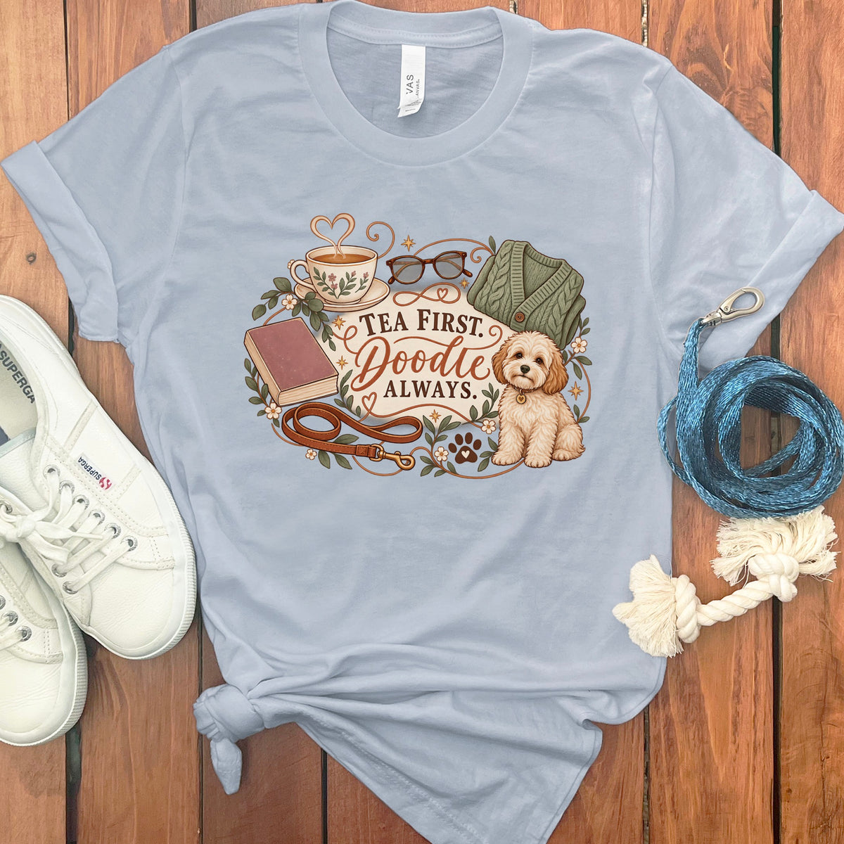 Light blue t-shirt with "Tea First. Doodle Always." text and dog graphic.