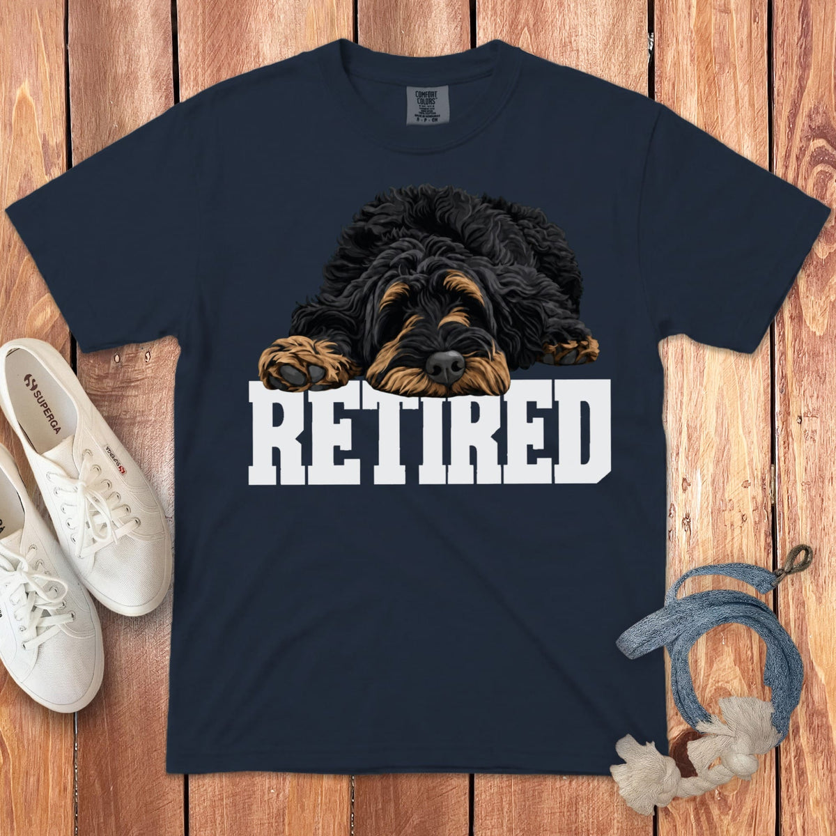Navy t-shirt with a black and tan doodle dog illustration and white text "RETIRED".