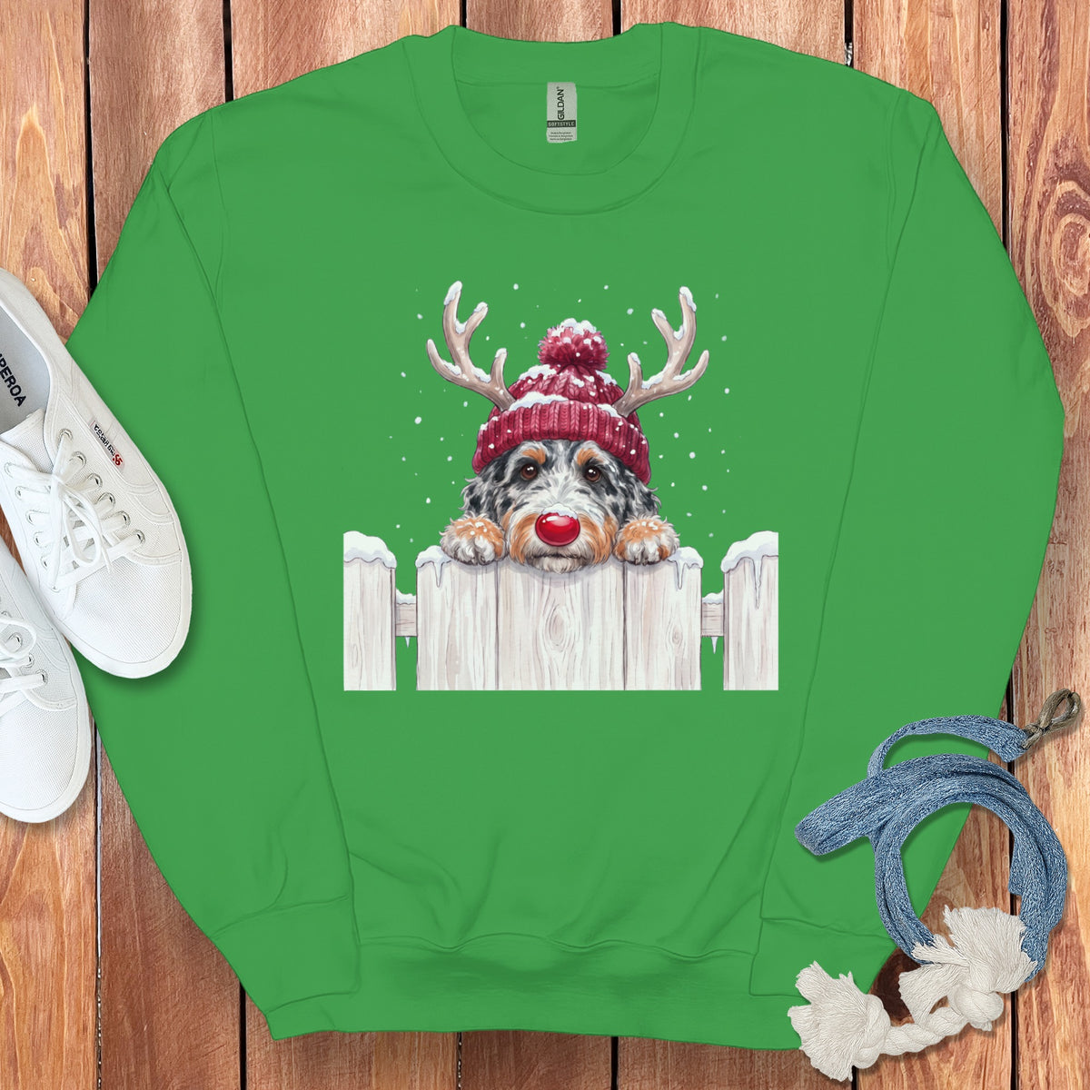 Green sweatshirt with a dog wearing a Santa hat and reindeer antlers.