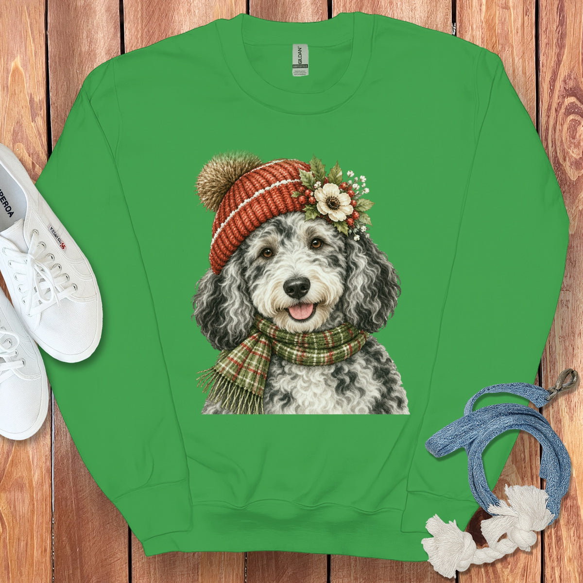 Green sweatshirt featuring a doodle dog wearing a winter hat and scarf.