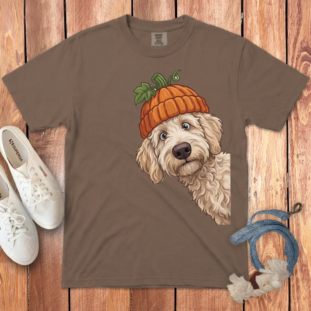 Brown t-shirt with illustration of a fluffy dog wearing a pumpkin hat.