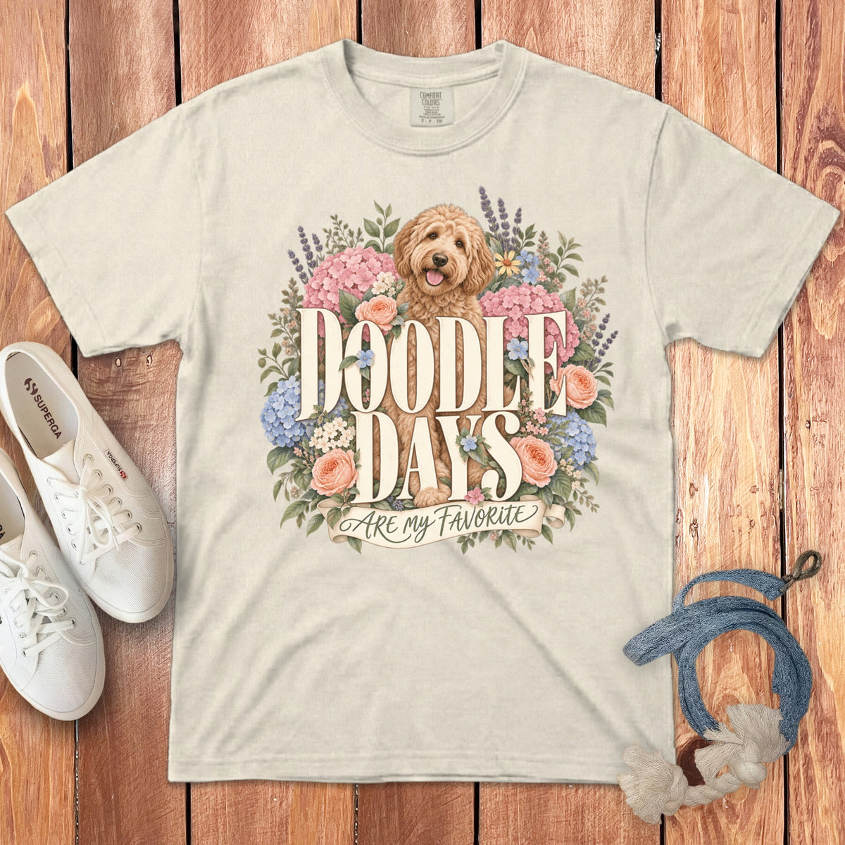 Cream t-shirt with a goldendoodle surrounded by flowers and the text "Doodle Days Are My Favorite".