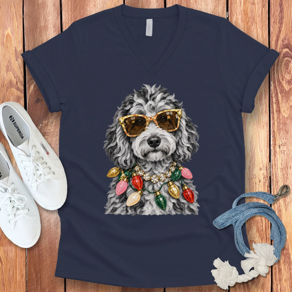 Navy t-shirt with illustration of a poodle wearing sunglasses and Christmas lights.