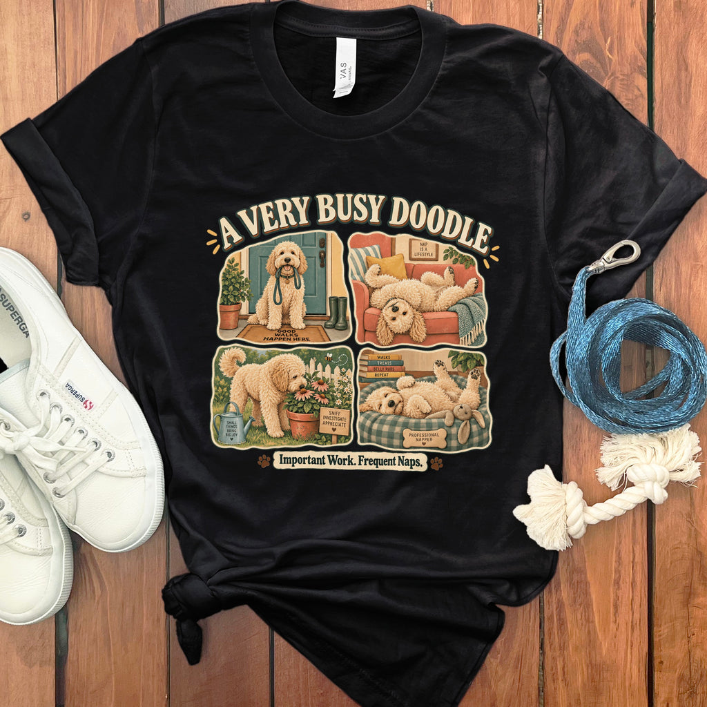 Black t-shirt with a four-panel illustration of a doodle dog and text.