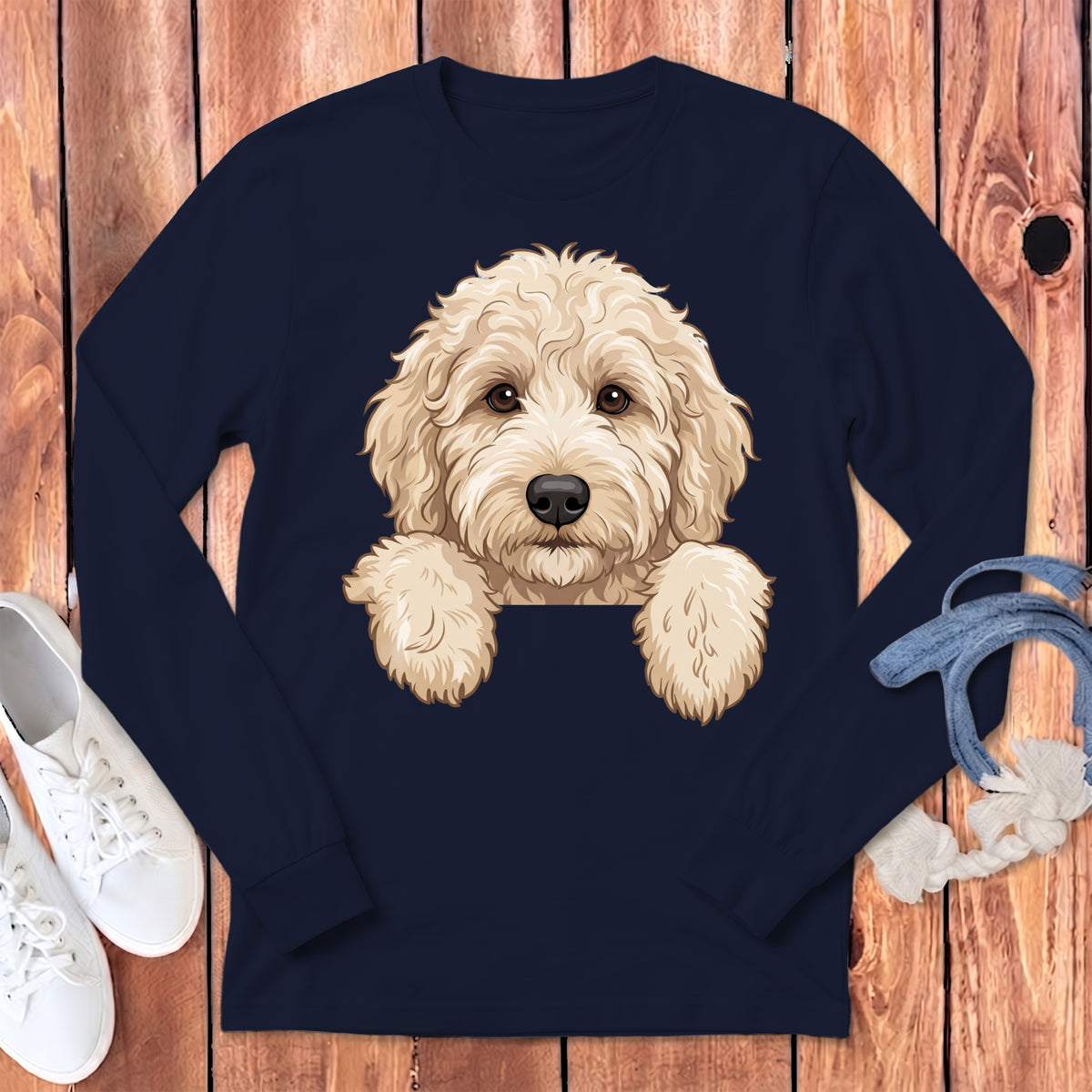 Navy long sleeve shirt with a cream doodle dog illustration peeking over the neckline.