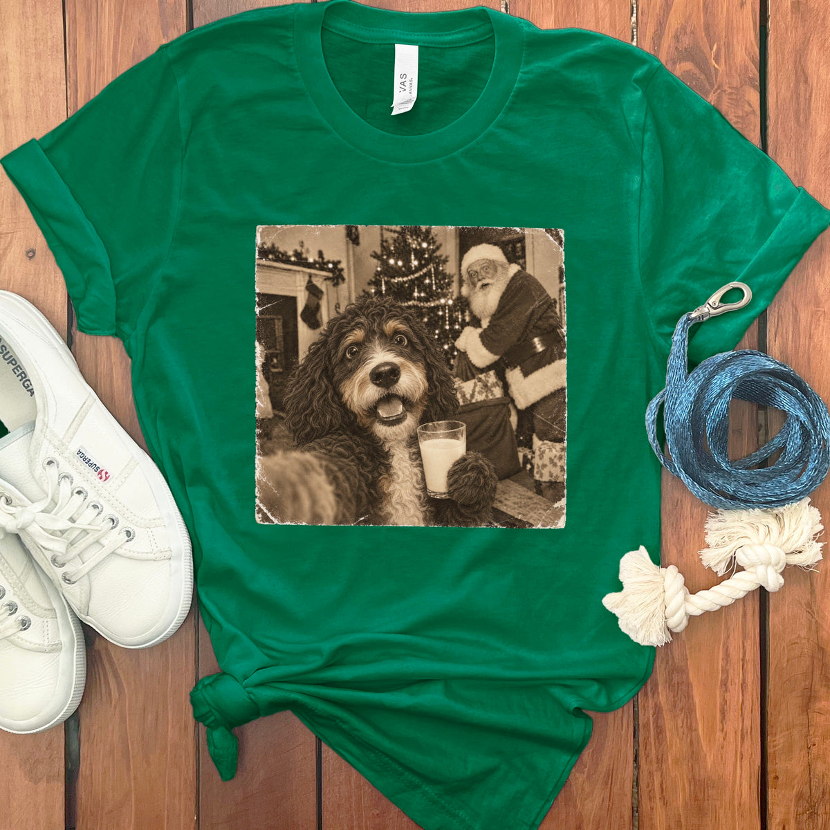 Bright green t-shirt featuring a retro graphic of a dog holding a glass of milk with Santa Claus in the background.