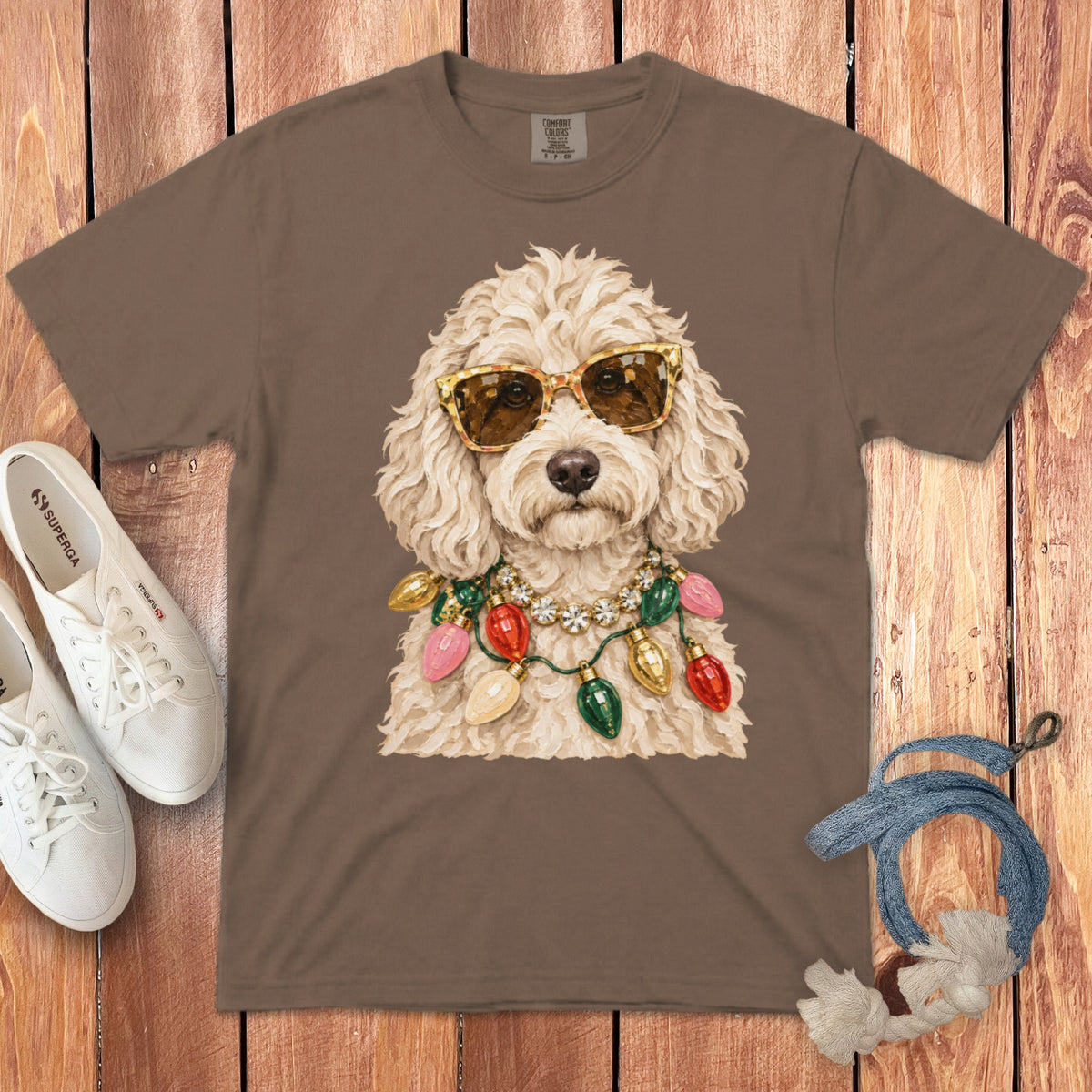 Brown t-shirt with a cream doodle dog wearing sunglasses and a Christmas light necklace.