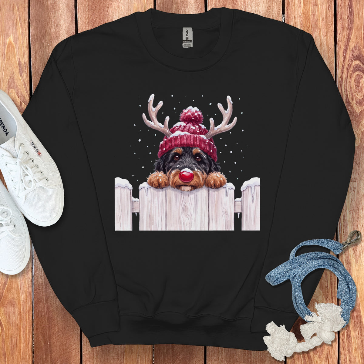 Black sweatshirt with a dog wearing reindeer antlers and a red hat.