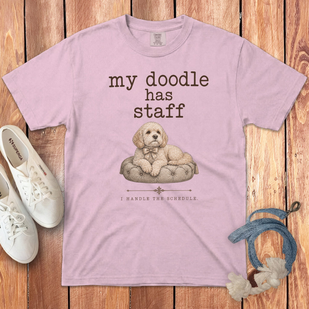 Light pink t-shirt with "my doodle has staff" and a doodle on a cushion.