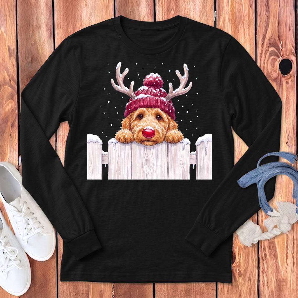 Golden retriever puppy wearing antlers and a red knit hat with pom-pom.