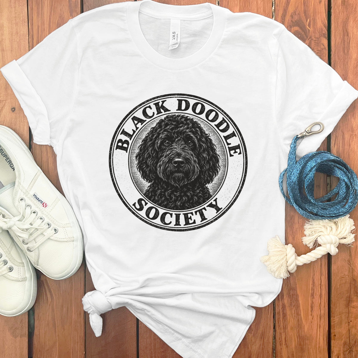White t-shirt with black doodle dog graphic and text "Black Doodle Society".