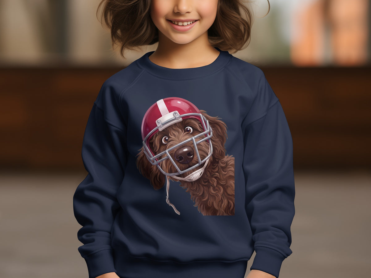 Brown dog with a red football helmet on a navy blue sweatshirt.