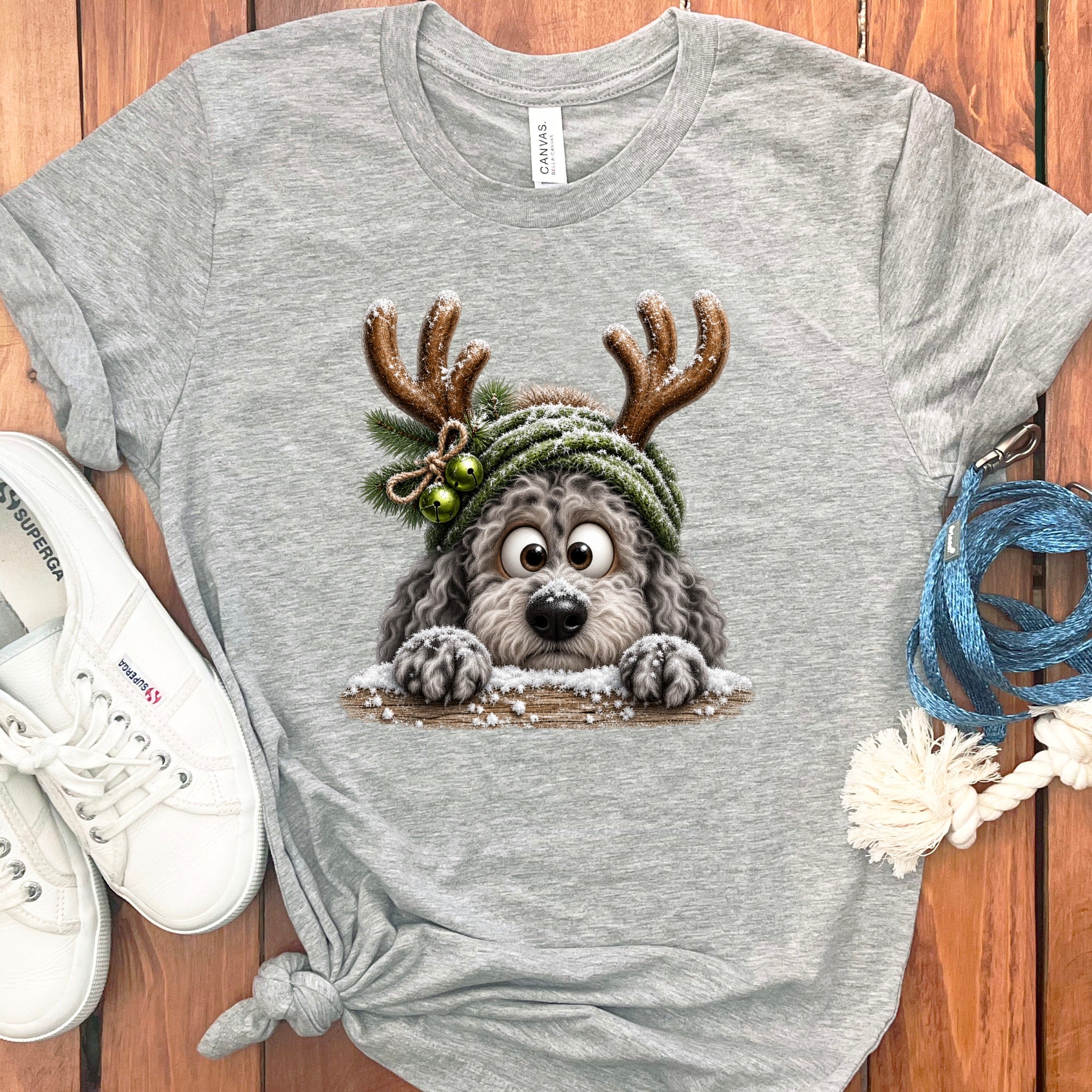 Grey t-shirt with a cartoon dog wearing reindeer antlers and a festive hat.