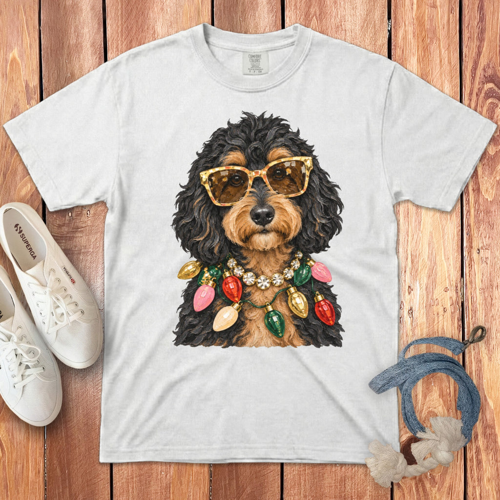 White t-shirt with dog wearing sunglasses and a string of Christmas lights.