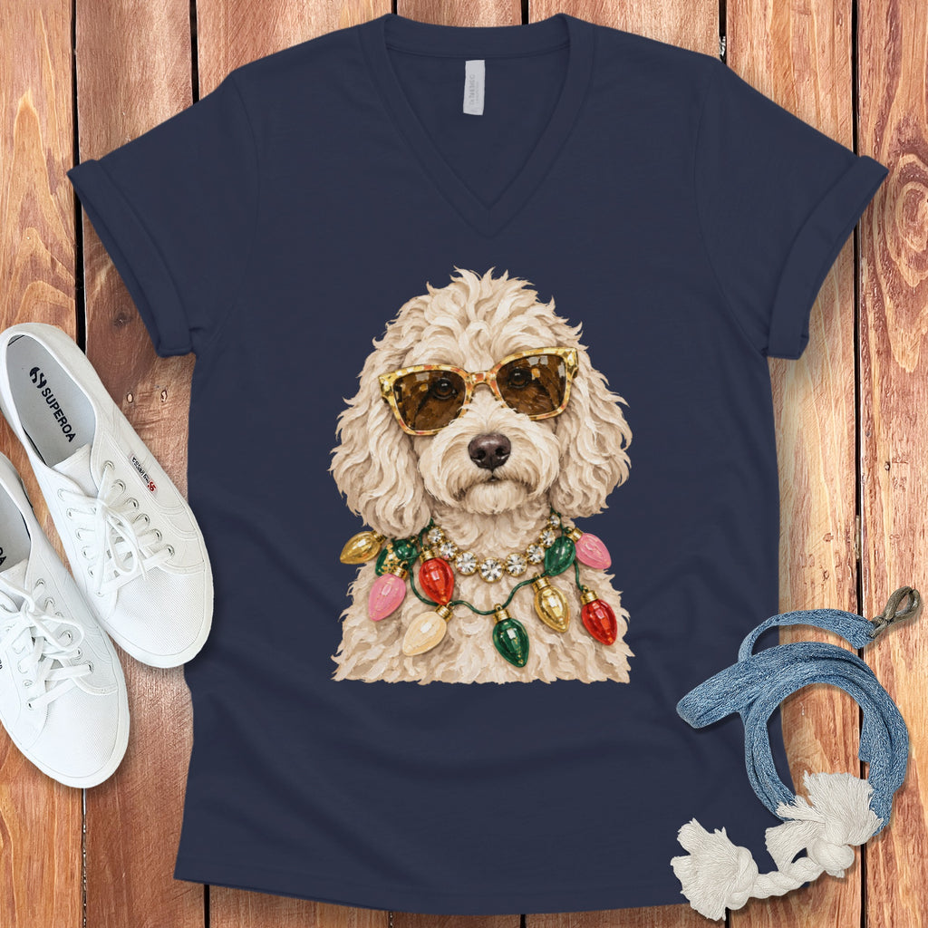 Navy v-neck t-shirt with a fluffy dog wearing sunglasses and a Christmas light necklace.