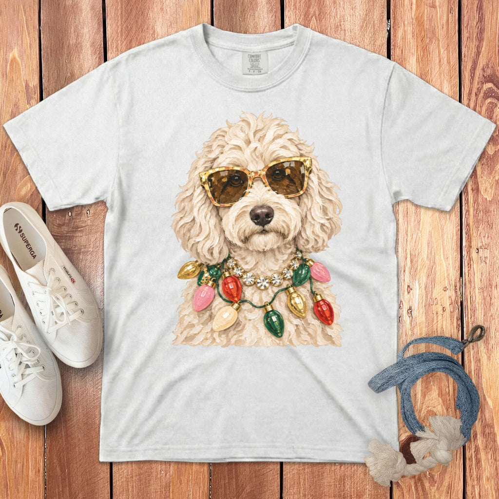 White t-shirt with a doodle wearing sunglasses and holiday lights.